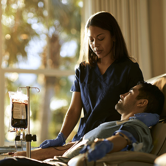 Licensed mobile phlebotomist providing gentle hemochromatosis care at home